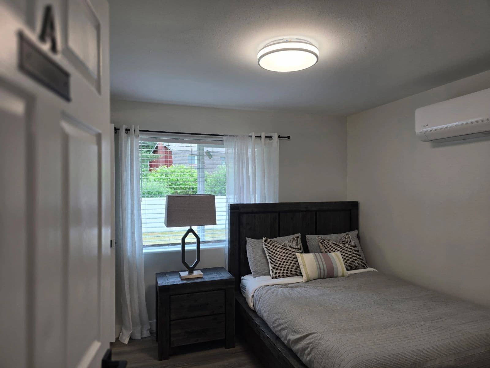 Comfortable resident bedroom with natural light